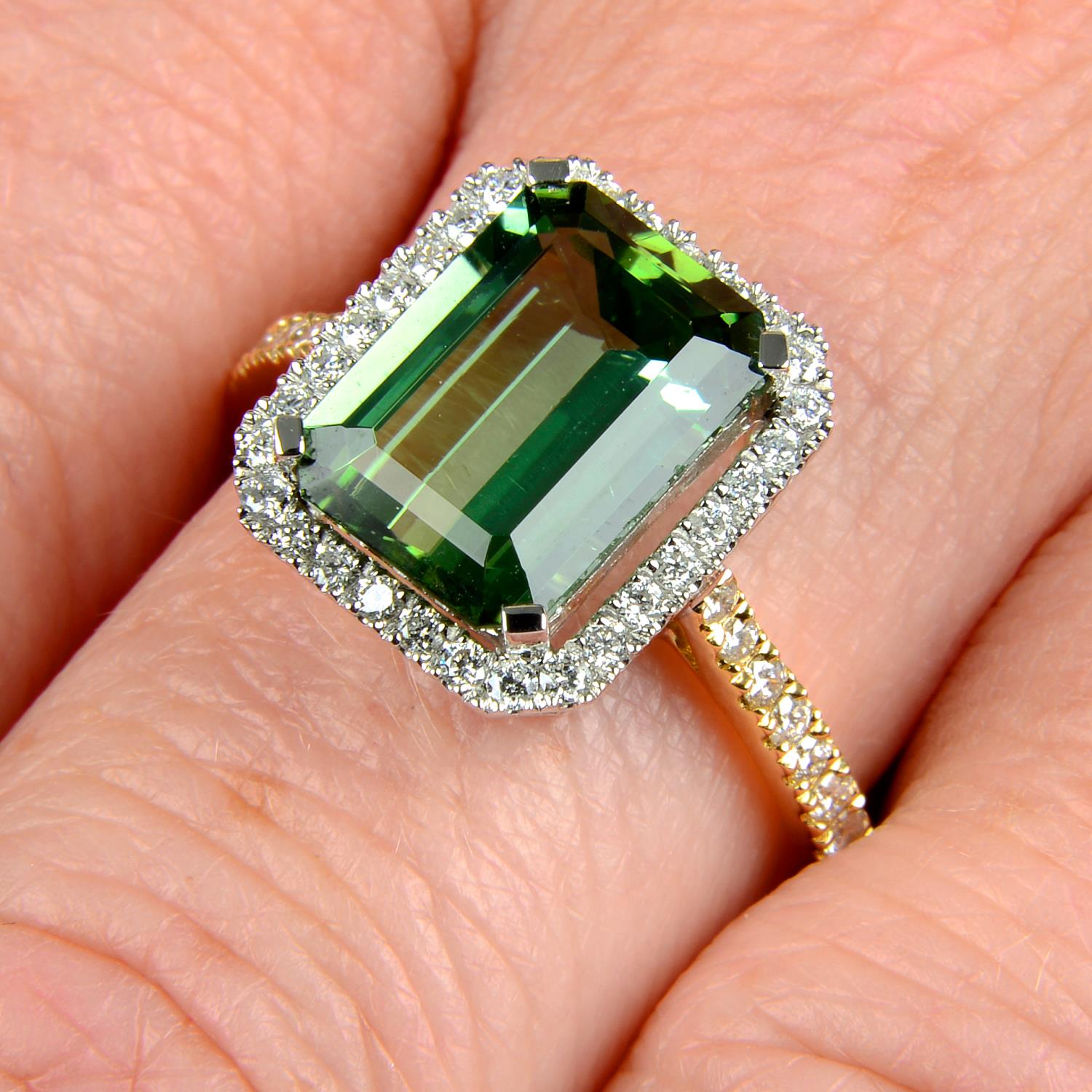 An 18ct gold green tourmaline and brilliant-cut diamond ring.Tourmaline weight 3.37cts.Total