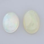 Two oval shape opals, weighing 12.25ct.
