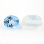An oval shape blue topaz and an oval shape moonstone cabochon.