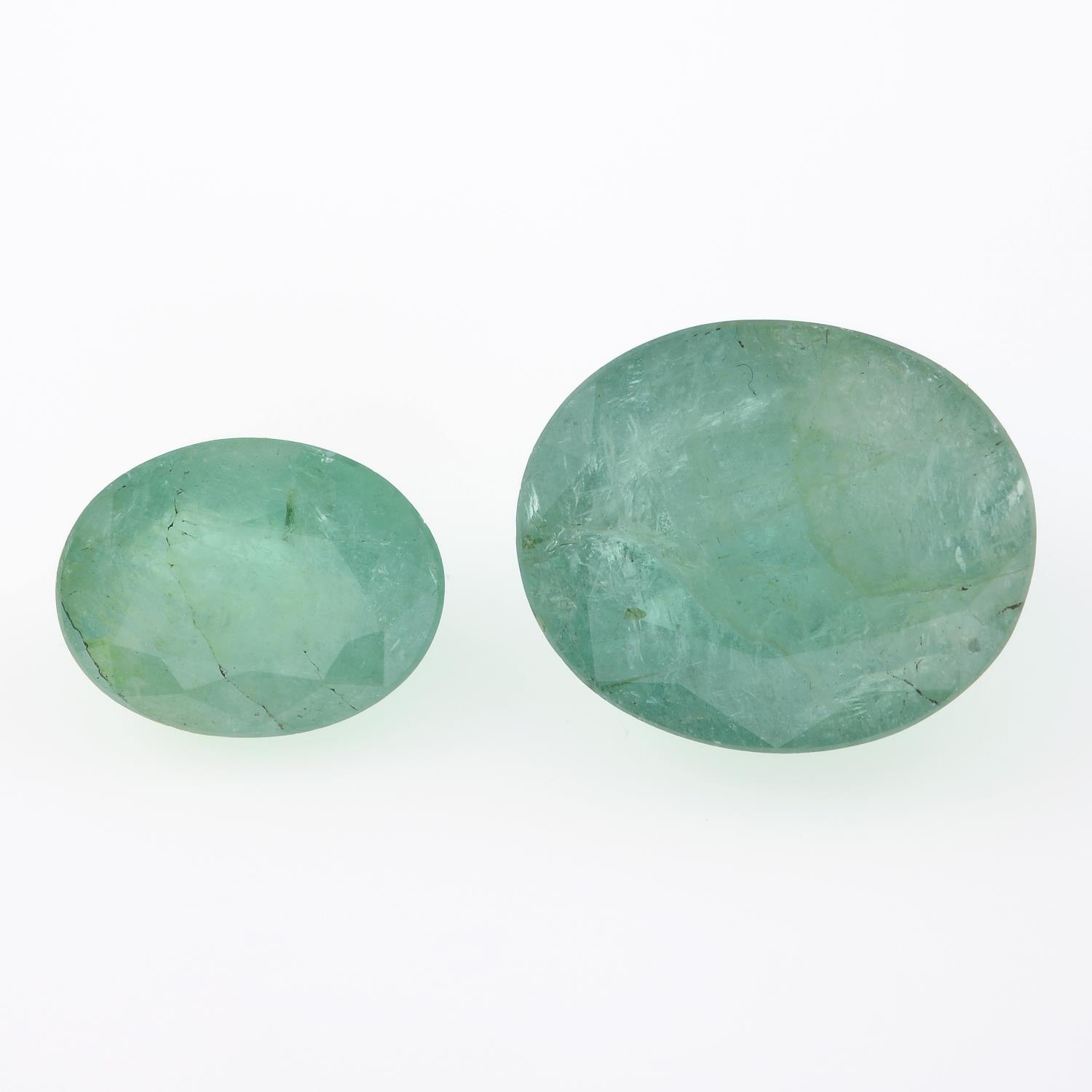 Two oval shape emeralds, weighing 13.33ct.