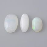 Three oval-shape opal cabochons.