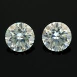 A pair of circular-shape colourless synthetic moissanite total weight 3.76cts.