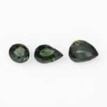 Nine vari-shape green sapphires.