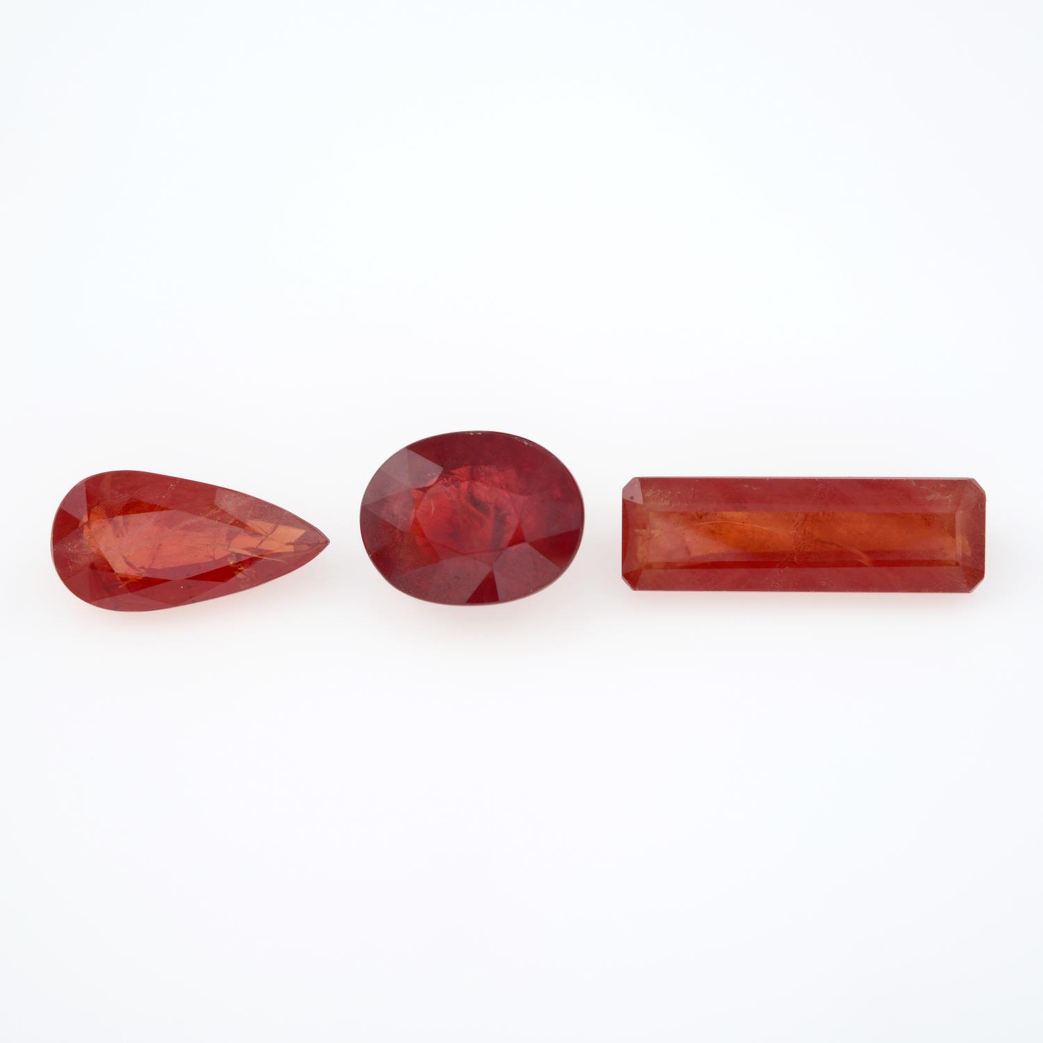 Three vari-shape orange sapphires, total weight 23.98cts.