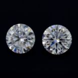 A pair of circular shape synthetic moissanite, weighing 7cts.