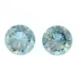 A pair of circular shape green moissanite.