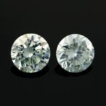 A pair of circular-shape colourless synthetic moissanite total weight 3.79cts.