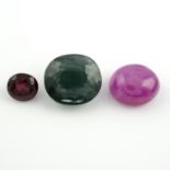 An oval shape rhodolite garnet, an oval shape ruby cabochon and an oval shape apatite.