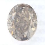 An oval shape fancy deep orangy brown diamond, weighing 1.06cts.