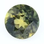 A circular-shape yellowy green sapphire.