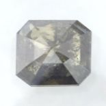 A rectangular shape fancy greenish brown diamond, weighing 1.12cts.