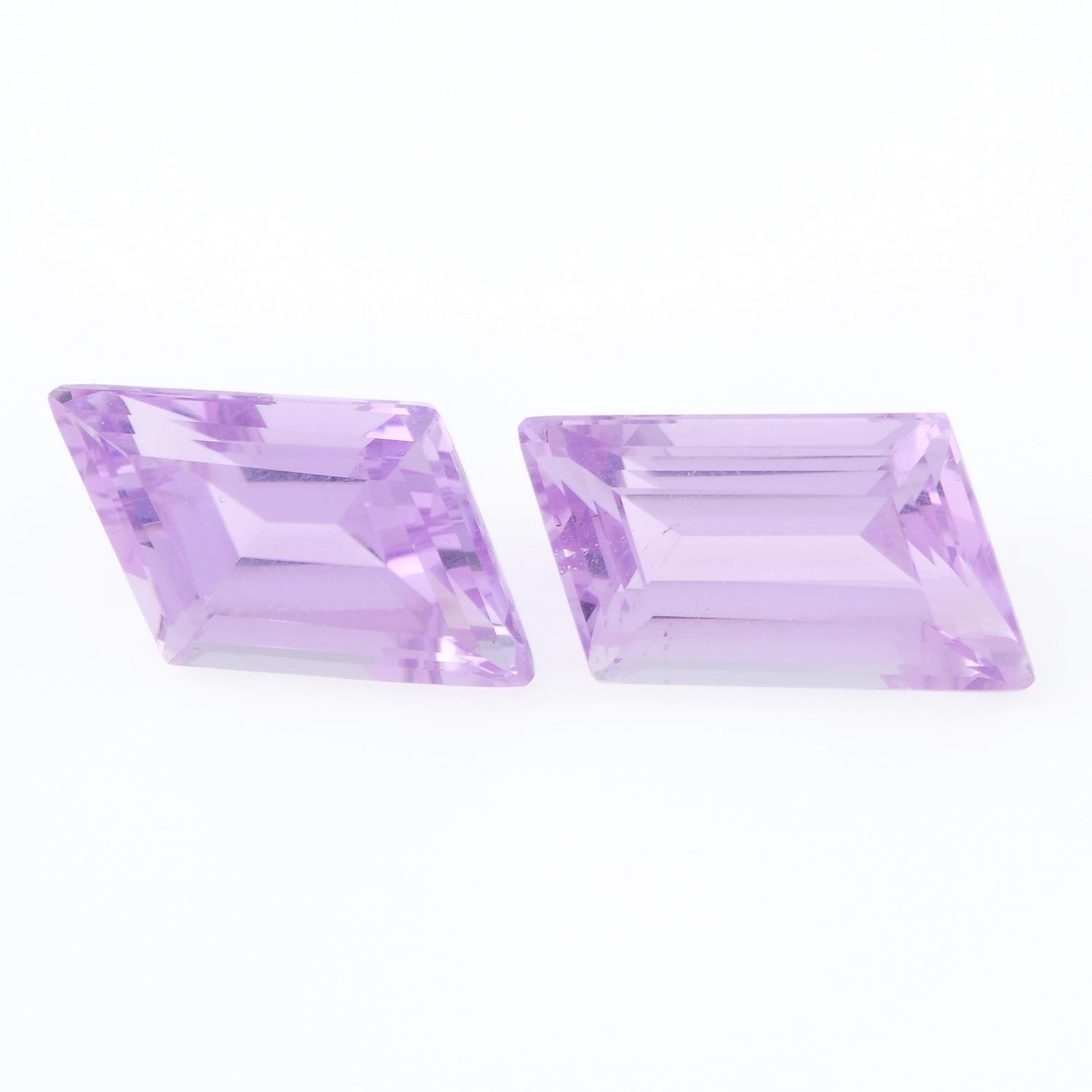 A pair of fancy shape kunzites weighing 13.51ct.