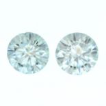 A pair of circular-shape blue moissanite.