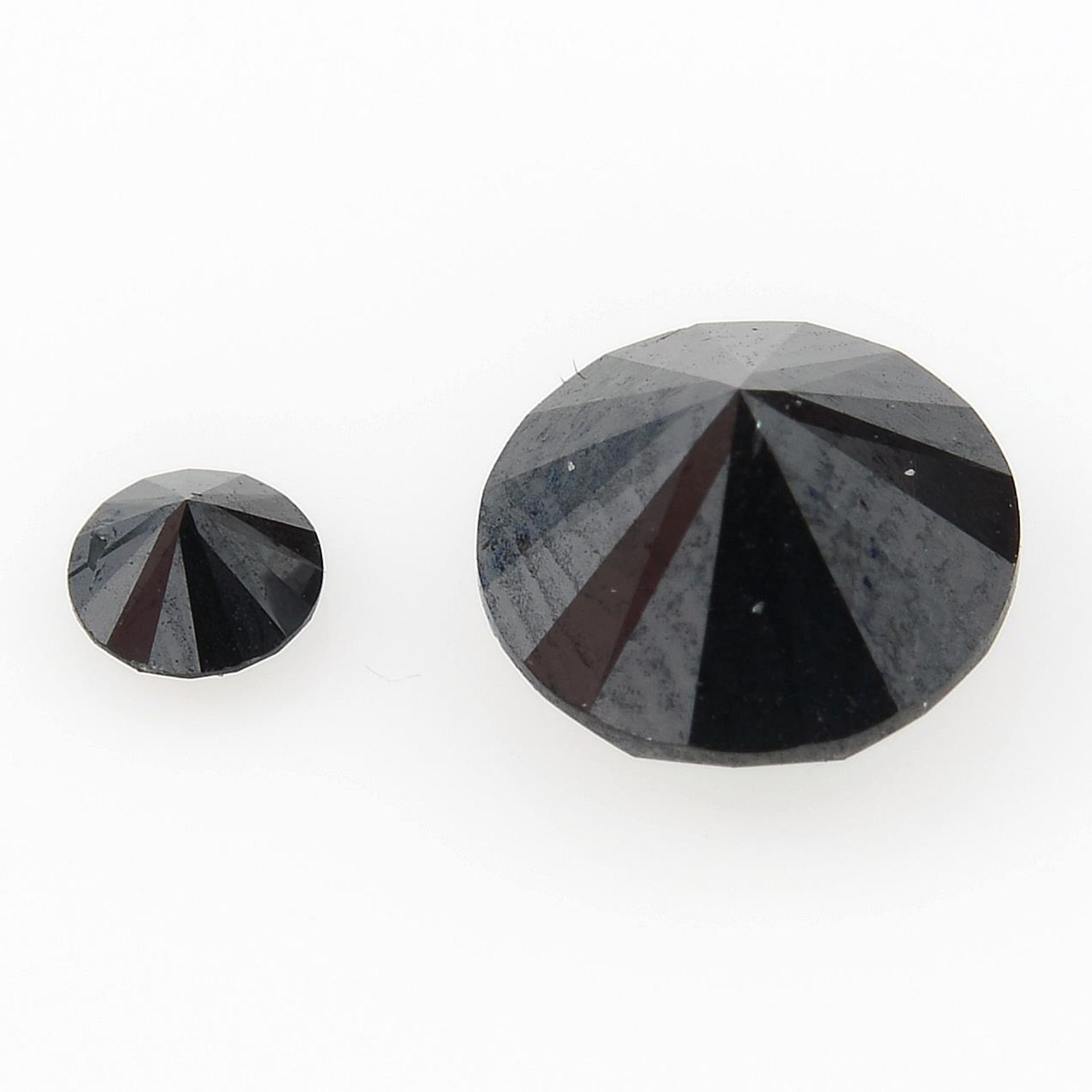 Two black gemstones, weighing 1.23ct. - Image 2 of 2