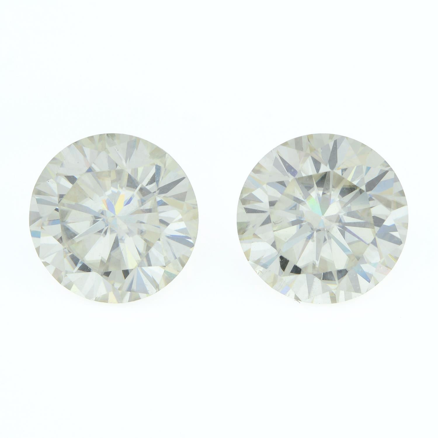 A pair of circular-shape synthetic moissanite, weighing 7.58cts total.