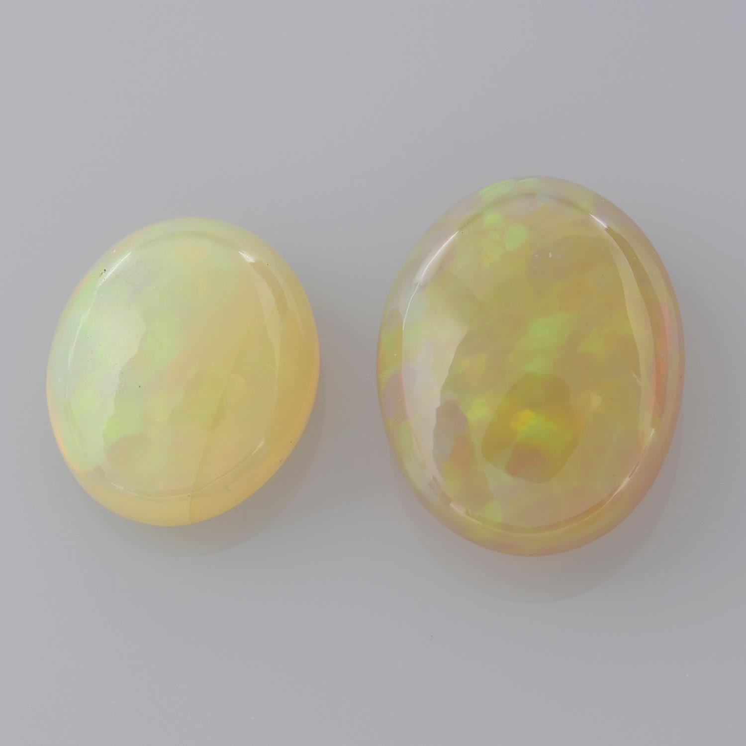 Two oval shape opal cabochons, weighing 10.66ct.