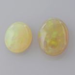 Two oval shape opal cabochons, weighing 10.66ct.