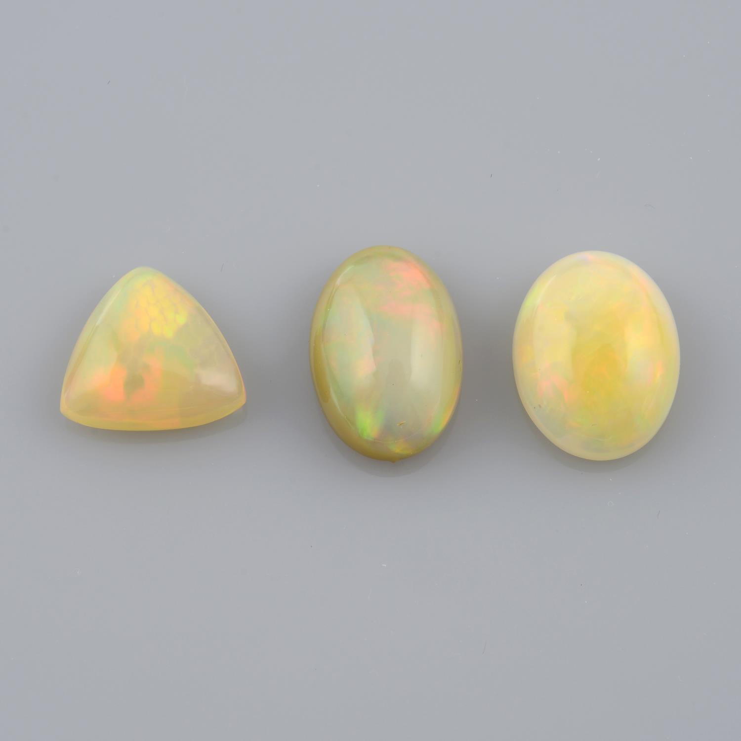 Four vari-shape opal cabochons, weighing 7.84ct.