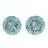 A pair of circular-shape green synthetic moissanite, weighing 13.72cts total.