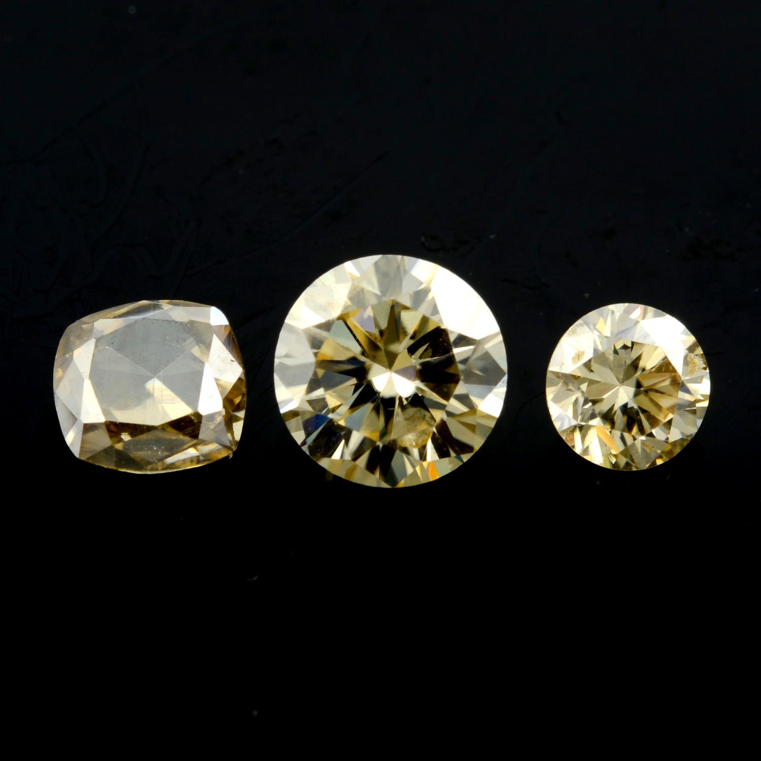 Three vari-shape moissanites.