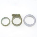 Two jade bangles and three jade rings,