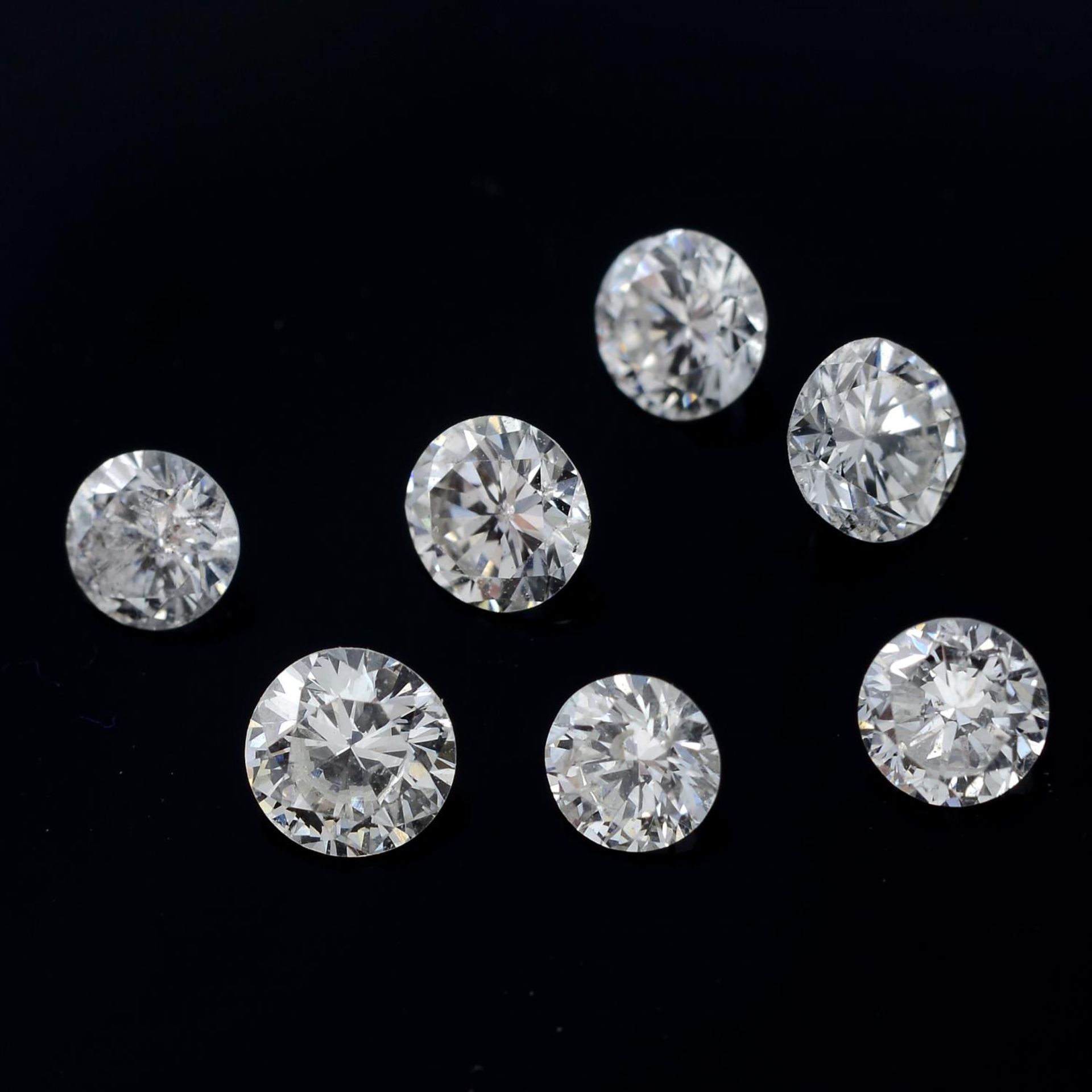 Seven brilliant-cut diamonds, weighing 0.84ct total.