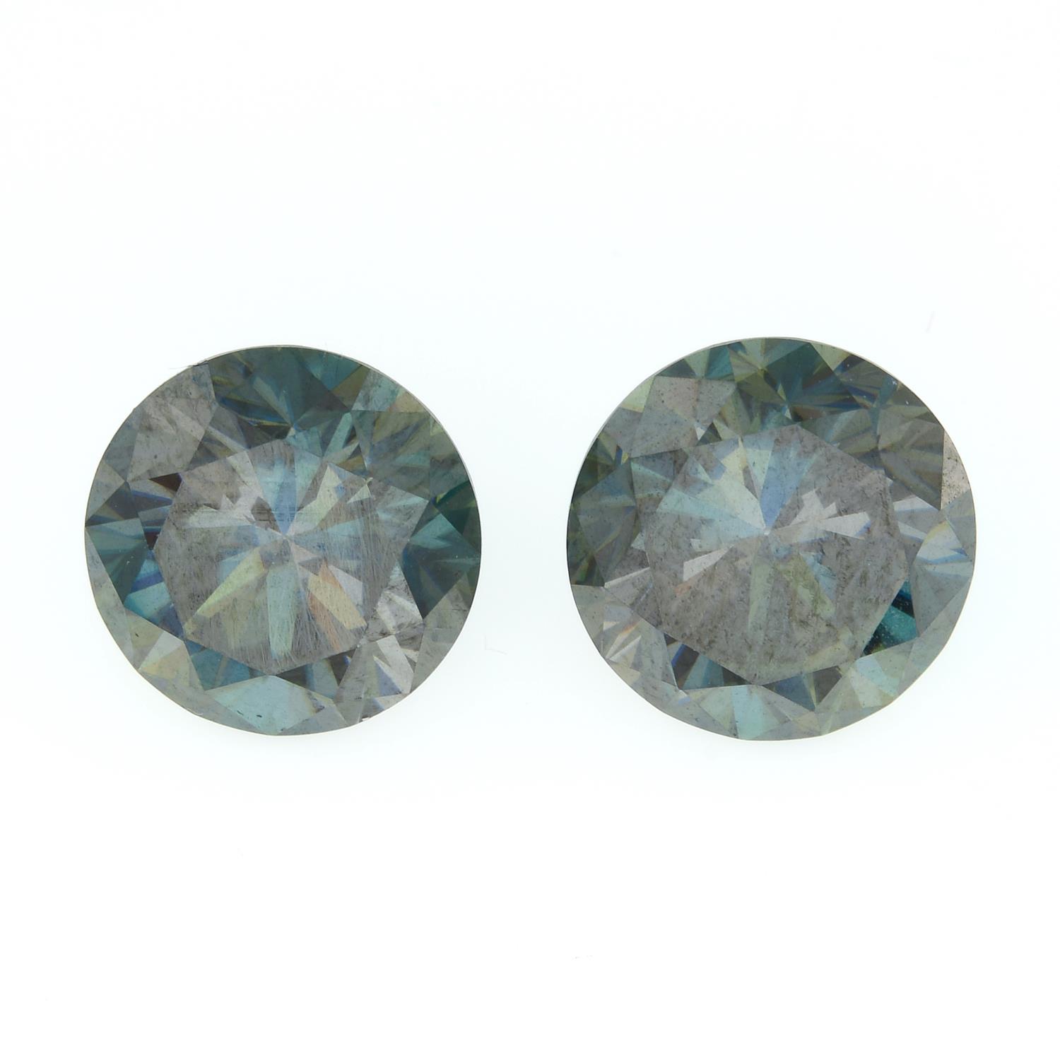 A pair of circular-shape blue moissanite.