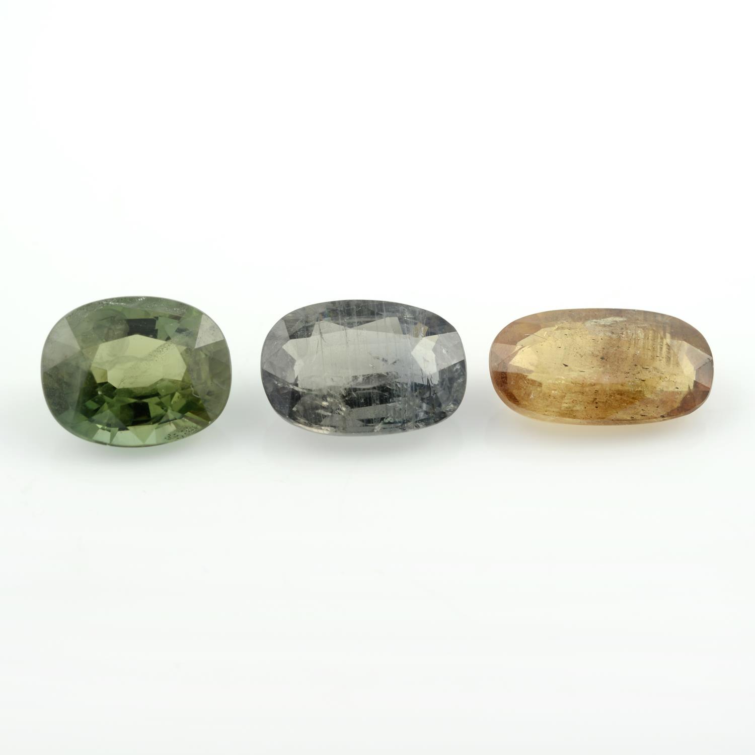 Three oval-shape, vari-hue sapphires.