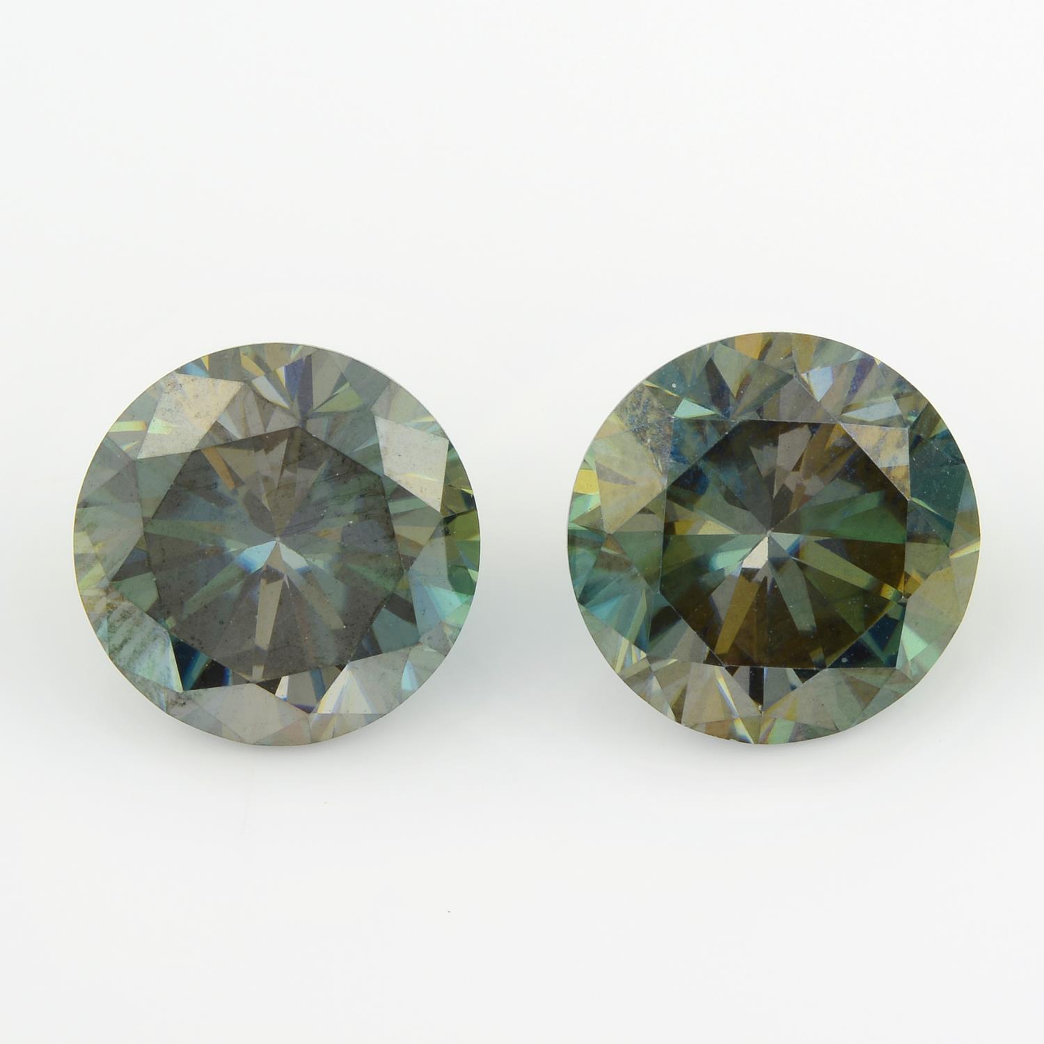 A pair of circular-shape green synthetic moissanite, total weight 6.30cts.