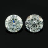 A pair of circular-shape colourless synthetic moissanite total weight 3.62cts.