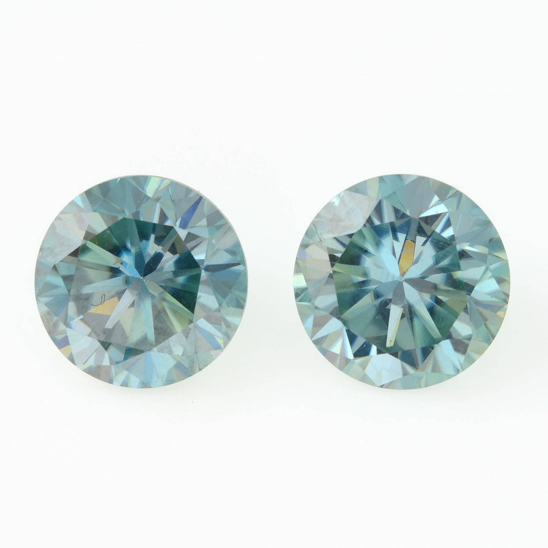A pair of circular-shape green synthetic moissanites.