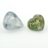 Two vari-shape, vari-hue sapphires.