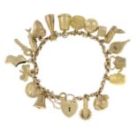 A 9ct gold charm bracelet with assorted charms.Hallmarks for London, 1963.Length 19cms.