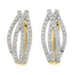 A pair of 9ct gold diamond hoop earrings.Estimated total diamond weight 0.65cts.Hallmarks for