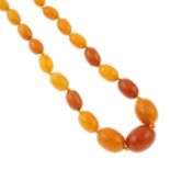 An amber graduated bead necklace.Amber is untested.Diameter of beads1.4 and 2.6cms.