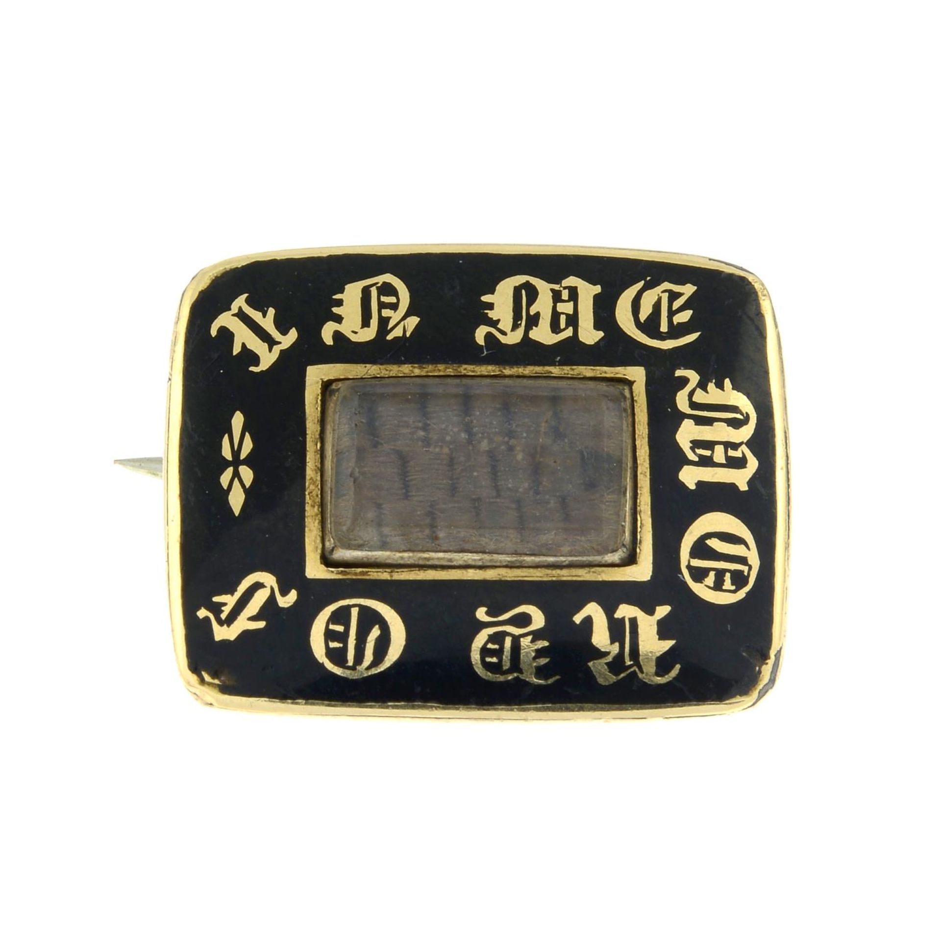 A Victorian black enamel memorial brooch.Length 1.7cms.