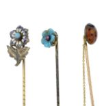 Three early 20th century enamel and gem-set stickpins,