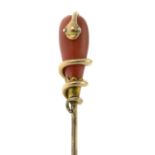 A late Victorian gold coral stickpin, with coiled snake accent.