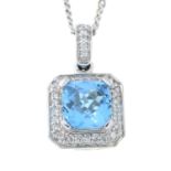 An 18ct gold diamond and topaz pendant with chain.Total diamond weight 0.44cts,