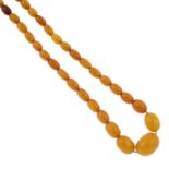 An amber graduated bead necklace.Amber is untested.Diameter of beads 0.8 to 1.9cms.