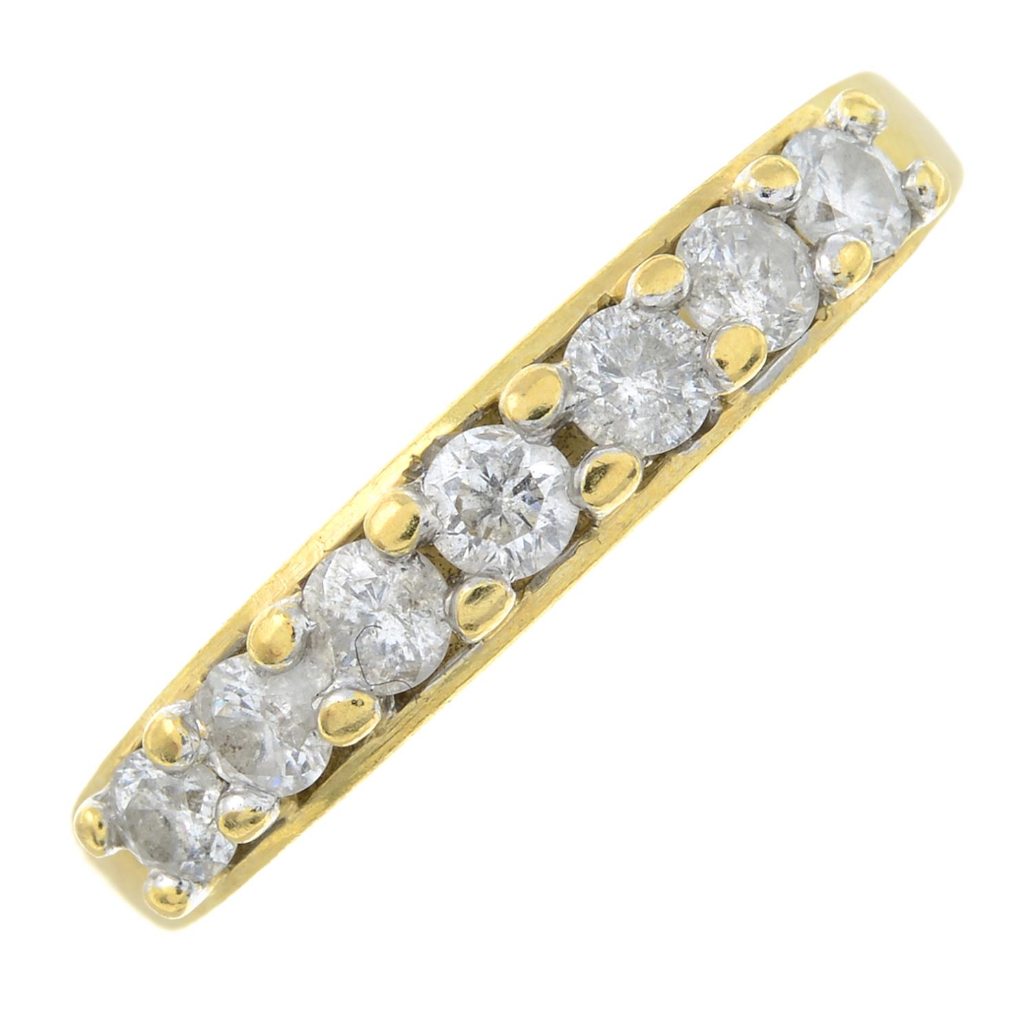 An 18ct gold seven stone diamond ring.Total diamond weight 0.50cts, stamped to band.