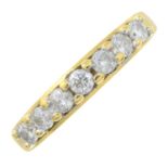 An 18ct gold seven stone diamond ring.Total diamond weight 0.50cts, stamped to band.