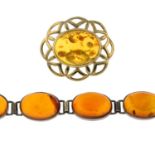 A modified amber brooch and bracelet.Bracelet stamped 925.Length of brooch 4cms.