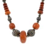 An amber and white metal bead necklace.Length 69cms.
