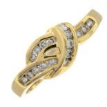 An 18ct gold diamond crossover ring.Estimated total diamond weight 0.17cts.Import marks London.