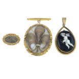 Two Victorian memorial brooches and a ceramic pendant.Length of brooches 2.9 and 6.2cms.