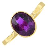 A purple garnet single-stone ring.Stamped 18ct.Ring size M.