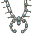 A Navajo tribal squash blossom turquoise necklace.Length 59cms.