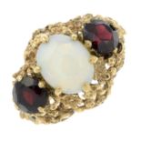 A 9ct gold opal and garnet floral dress ring.Hallmarks for Birmingham.Ring size P.
