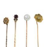 Four gem-set stickpins,